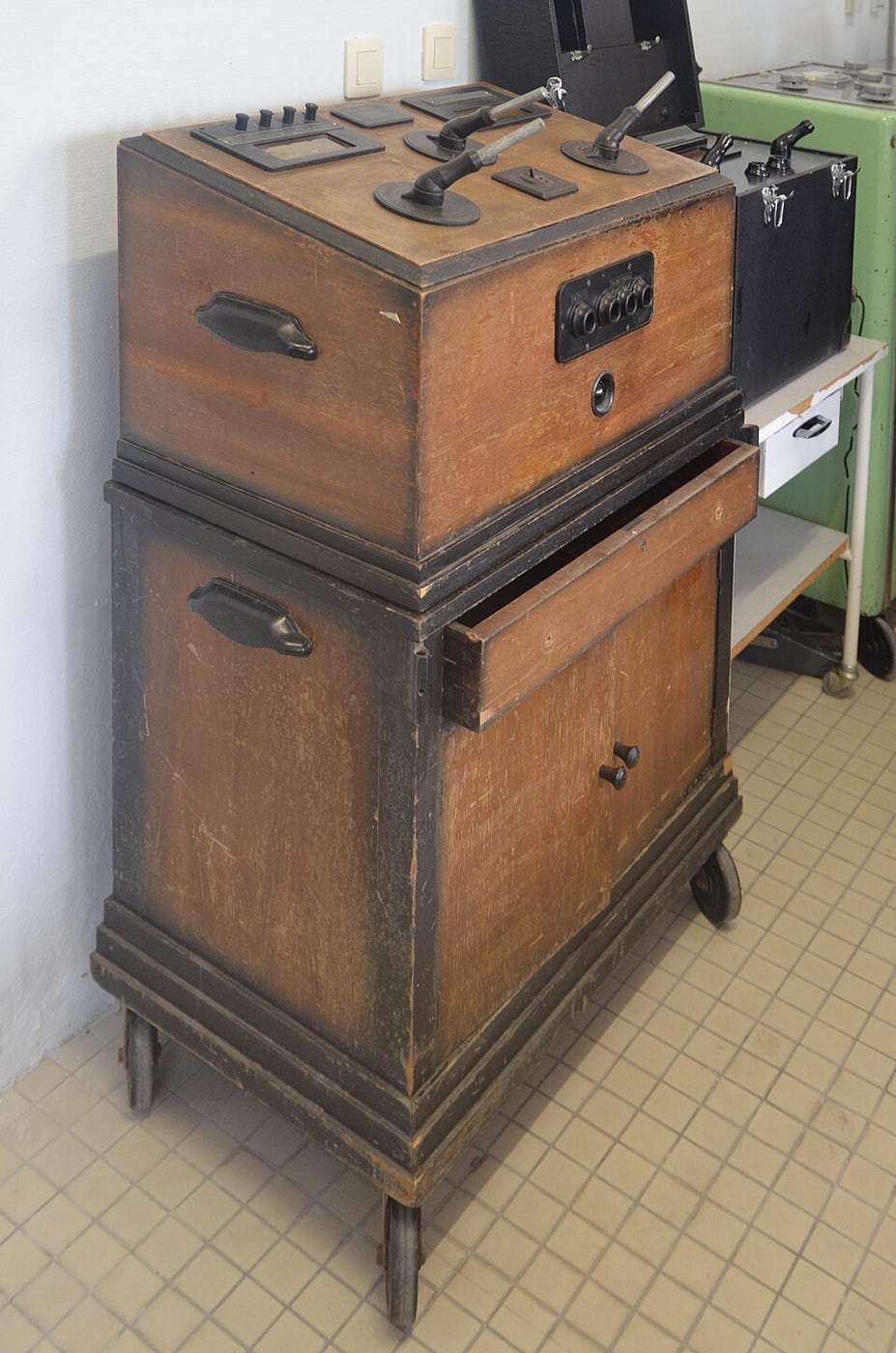 Figure 3 — Left, a physiotherapy diathermy cabinet with broad pad applicators for diffuse deep heating; right, an early electrosurgical ("Bovie") generator with a fine active electrode for cutting and coagula…
