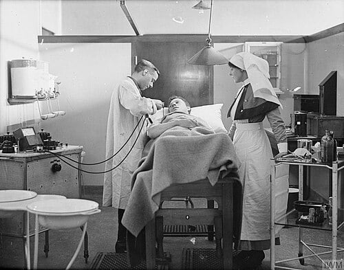 Figure 2 — A hospital physiotherapy department of the 1930s–40s with a short-wave diathermy apparatus in use. In this period the same machines served both routine deep-heating therapy and, in specialist units…
