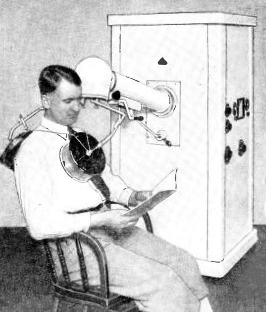 Figure 1 — A cased short-wave diathermy unit of the physiotherapy-department pattern: a dial-and-meter front panel with an output-tuning control, and a hinged drum applicator on an articulated arm. The tuning…