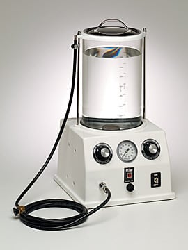 Figure 3 — A Porti-Boy in its cabinet with the graduated glass tank seated on top — the compact, carry-it-anywhere form the name records.