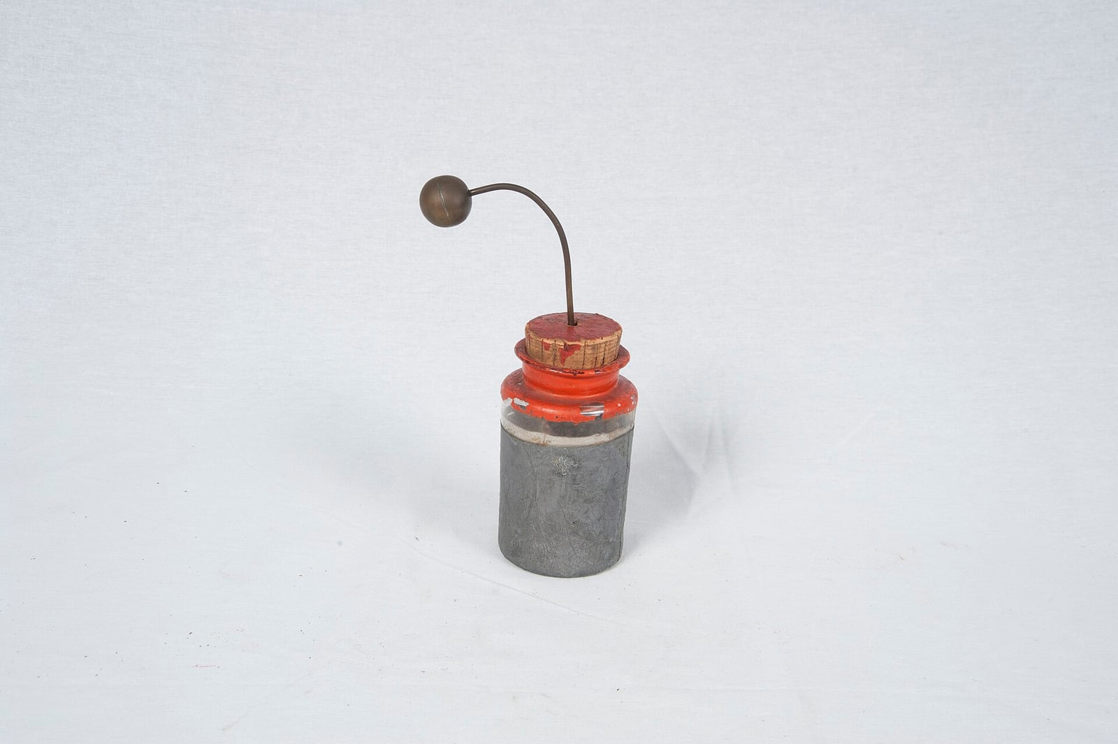 Figure 2 — A surviving jar, foil-lined and stoppered, with its ball terminal on a bent rod. Every electrotherapeutic machine that follows in this wing is, at bottom, a way of charging something like this and …