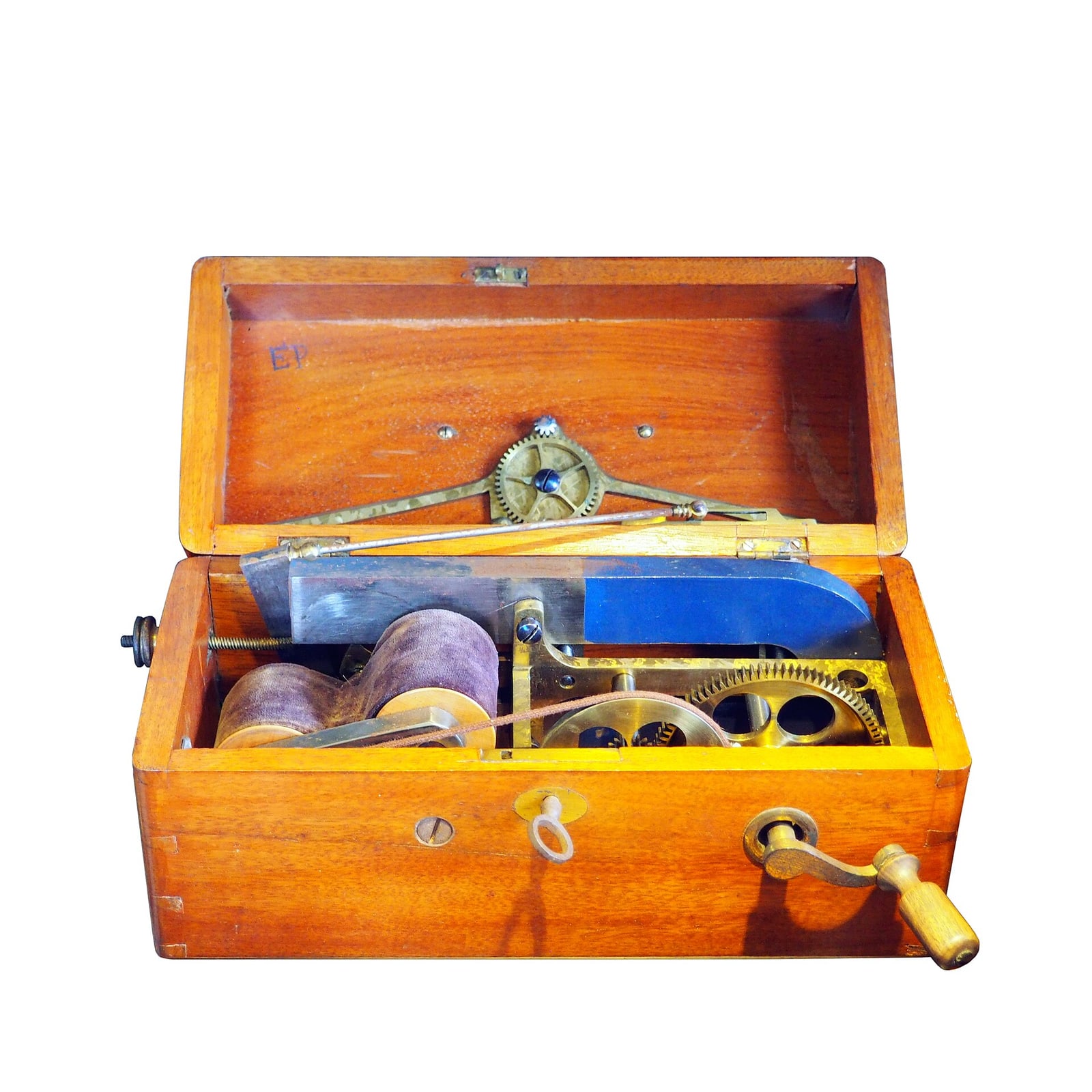 Figure 1 — The physician's portable machine, lid up: a magneto-electric outfit in its fitted wooden case, with the horseshoe magnet and armature, the gear train and crank handle, the coil, and the electrode c…