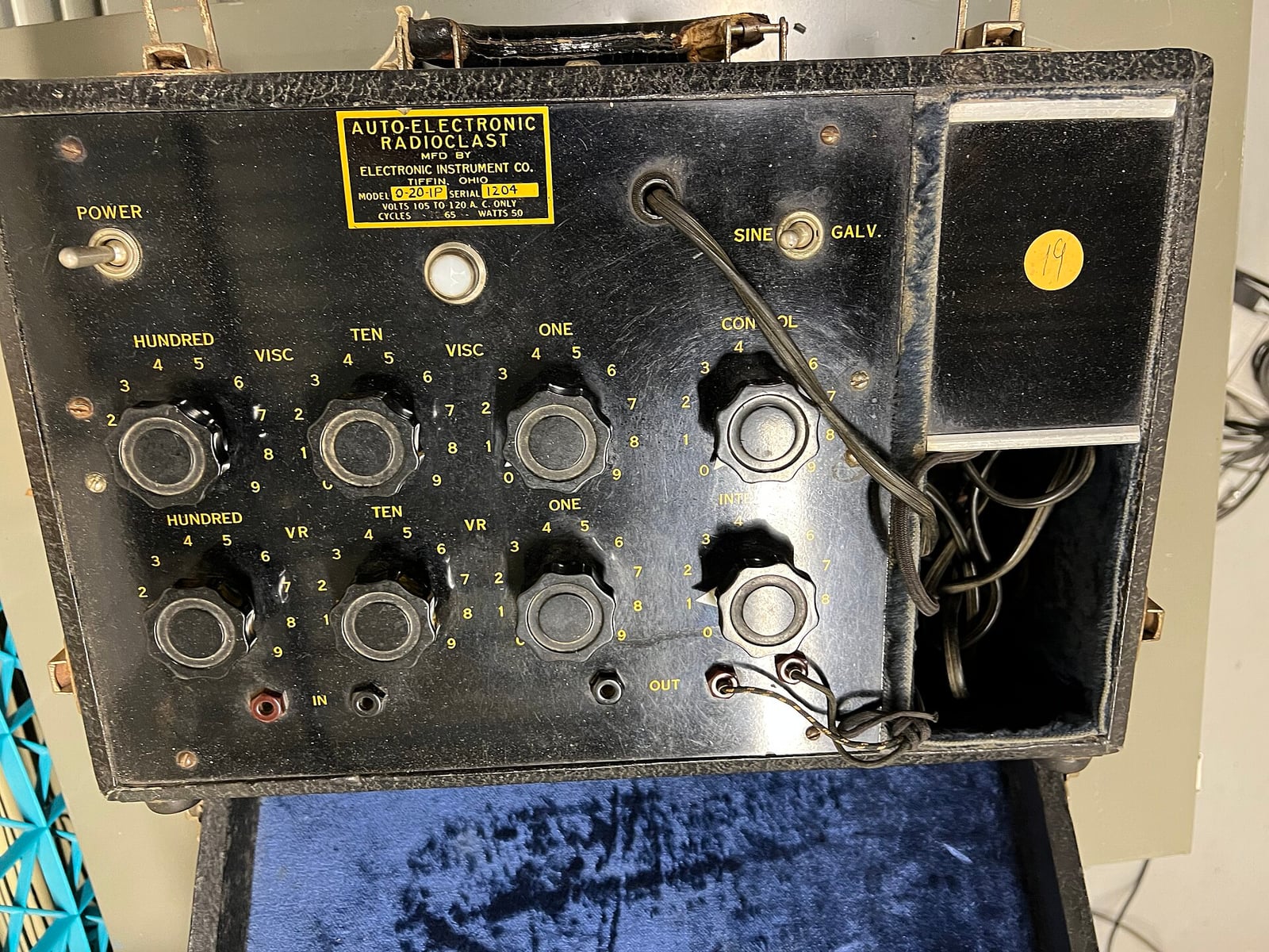 Figure 5 — An Auto-Electronic Radioclast, opened — a machine of the Abrams lineage. Six rate dials in hundreds, tens and ones, a "SINE / GALV." selector, input and output jacks, and behind them a circuit that…