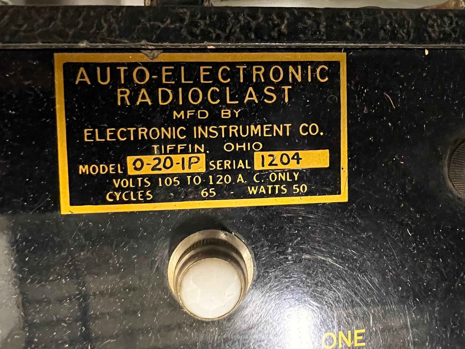 Figure 1 — What to photograph first, and what dates a machine: "AUTO-ELECTRONIC RADIOCLAST, Mfd by Electronic Instrument Co., Tiffin, Ohio — Model 0-20-1P, Serial 1204, Volts 105 to 120 A.C. only, Cycles 65, …