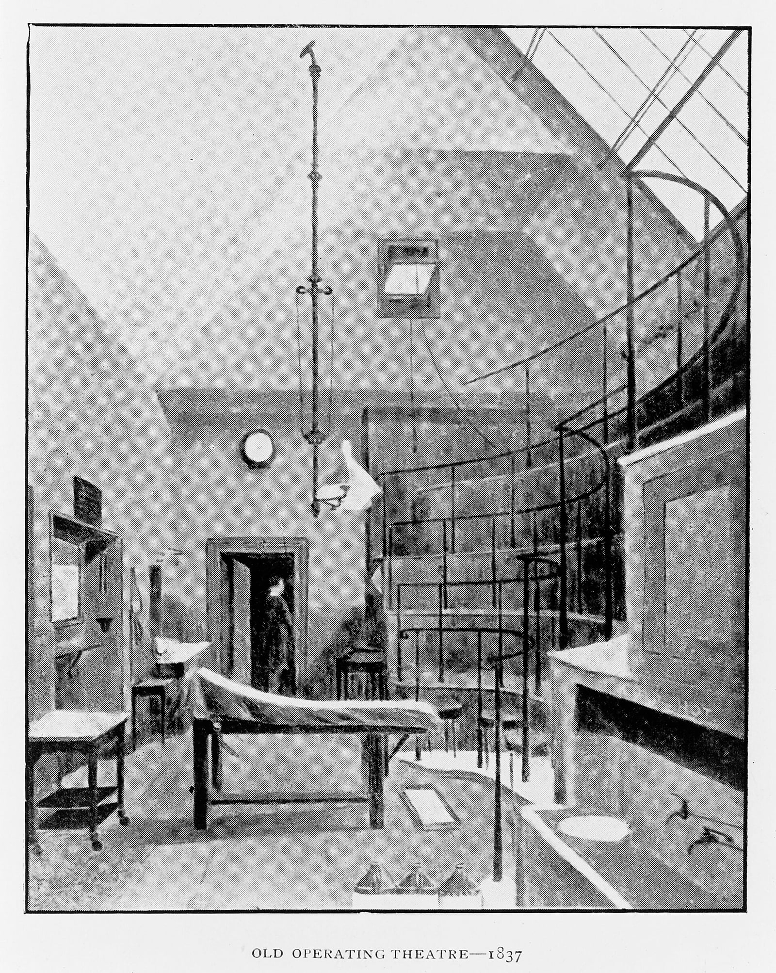Figure 1 — An operating theatre of 1837 — wooden tiers, a plain table, bare boards. Nothing in the room can be sterilized, because nobody yet thinks it needs to be: this is the theatre asepsis would demolish.