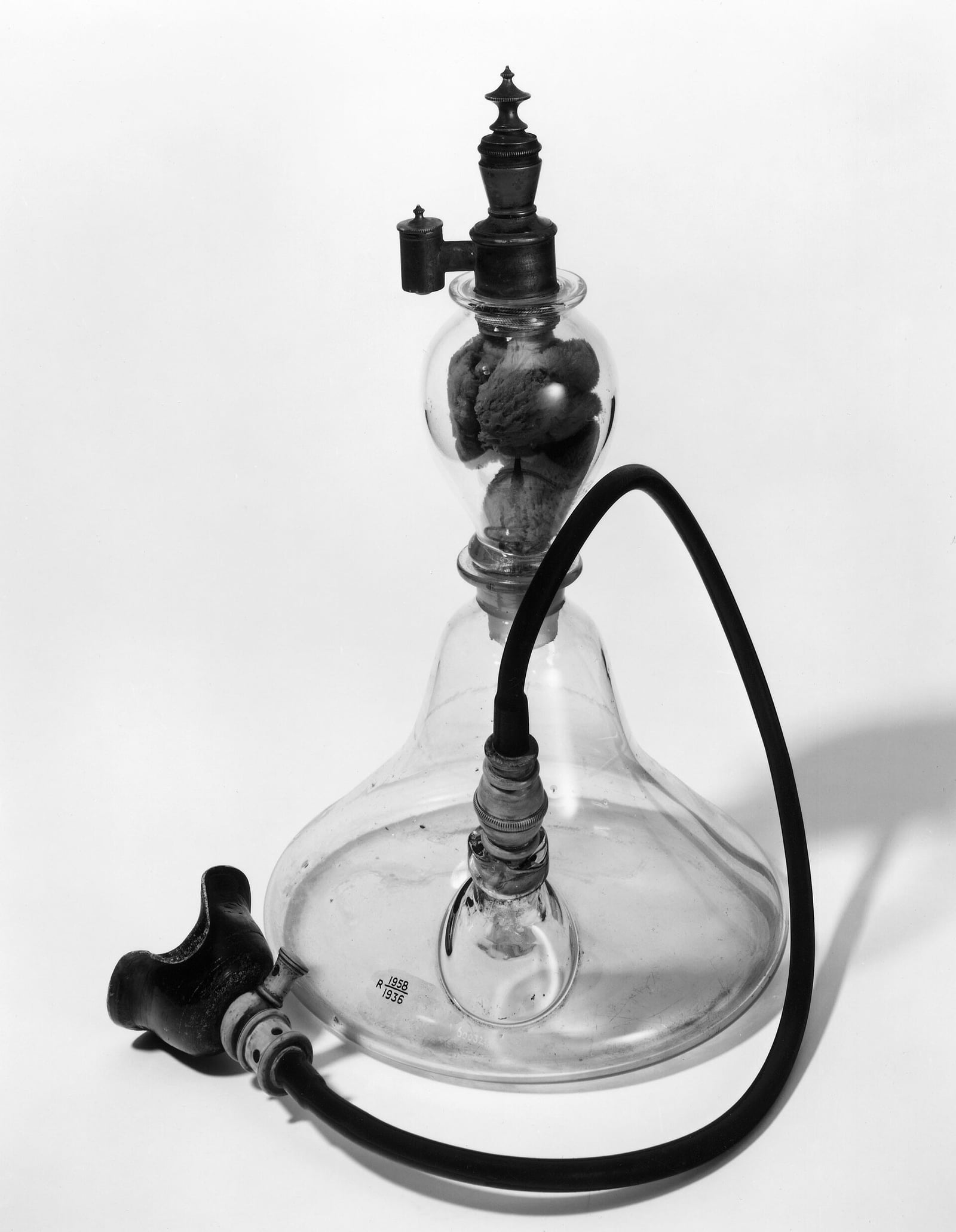 Figure 2 — A Squire-type ether inhaler — the glass-globe pattern used for the first ether operation in Britain, weeks after Ether Day, and the same idea as Morton's: a vapor chamber, a tap, and a tube to the …